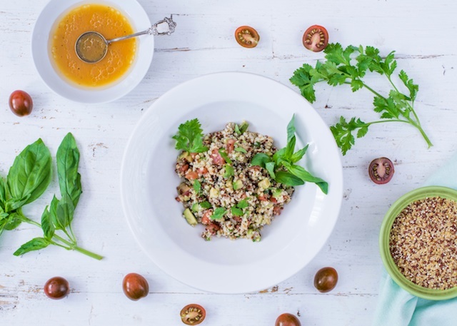 Quinoa salad. Vegetables with orange dressing