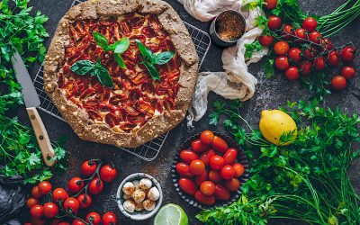 Galette of tomatoes with cream cheese and basil.