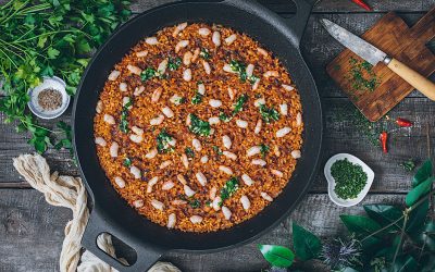 Rice in paella with squid and prawns